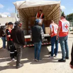 ICRC staff in Lebanon unloading aids from a truck.