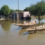 Residents using a canoe to go from one place to another