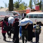 Families crossing the border from Lebanon to Syria. Ammar Saboh/ICRC
