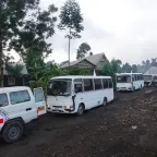 DRC transfer 30-02-2025 ICRC vehicles and white buses line up