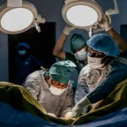 Doctors in surgery in an operating room.