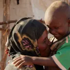 Somalia. Nadifa, her son and the rest of her family have been displaced because of armed conflict, and now live in makeshift shelters.  Somalia. Nadifa, her son and the rest of her family have been displaced because of armed conflict, and now live in makeshift shelters. The ICRC works with the Somali Red Crescent Society to provide them and other displaced people with support for meeting their basic needs and improving their living conditions.