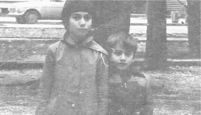 Khonelia Aida and Eduard standing together as children