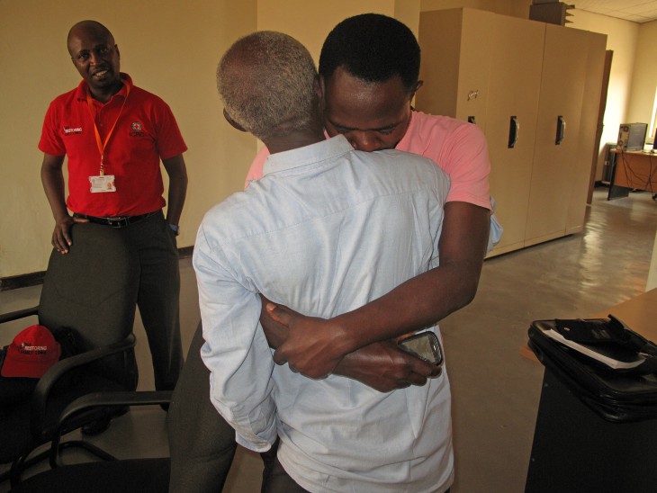Raymond Ngendahimana embraces the father he has not seen for 22 years, after tracing him through the ICRC.