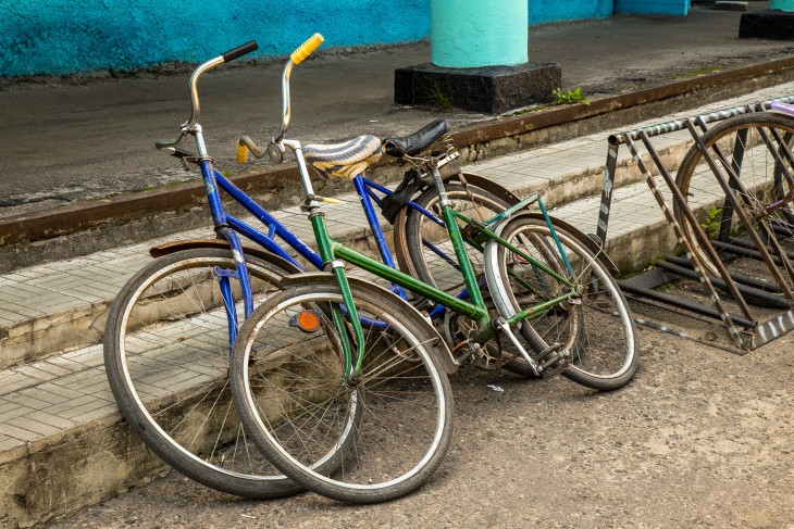 Two bicycles await their owners near the warehouse where food and other essentials are being distributed to people still suffering the effects of recent fighting. 