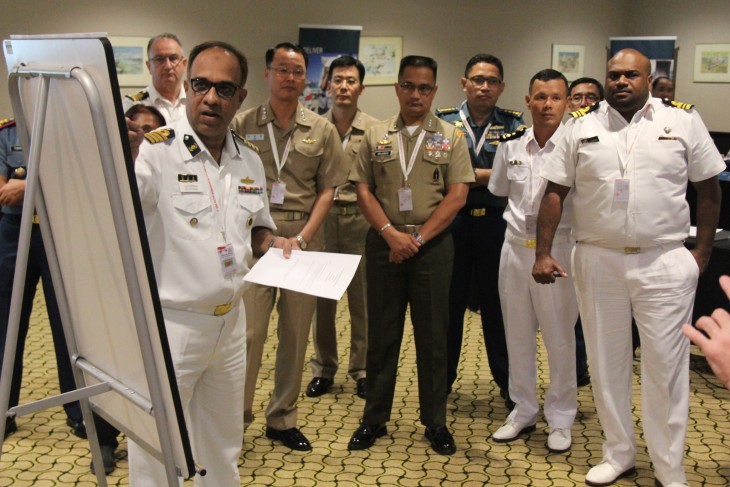 A participant presents his work to officers from several of the region's navies during the workshop, which covered not only naval warfare but also anti-piracy operations, rescue and the movement of people at sea.