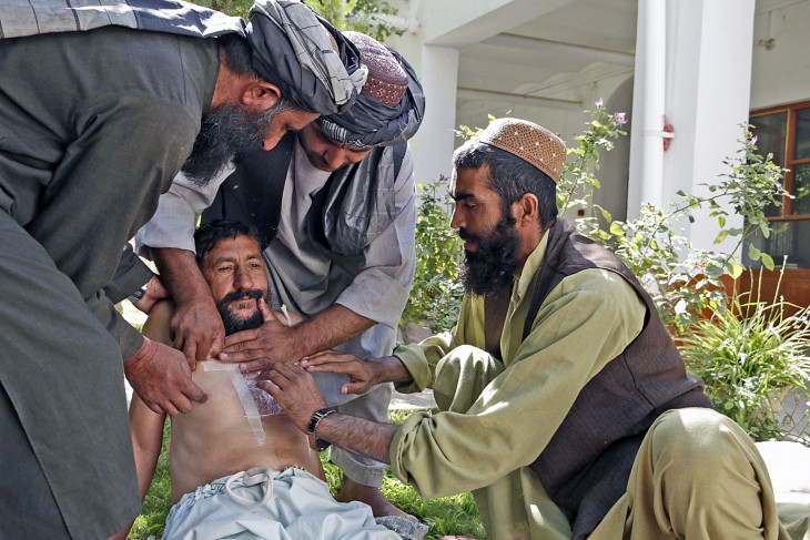 Kandahar, Afghanistan, 29 August 2016. Abdul Wali (right) practices giving first aid to a man with a chest wound.