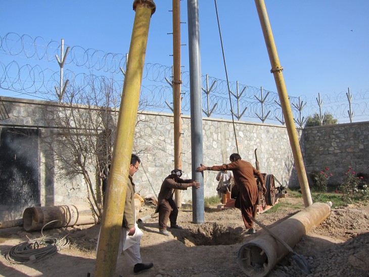 Farah Provincial Prison, Farah Province, Afghanistan. Workers sink a borehole for the new water supply system.